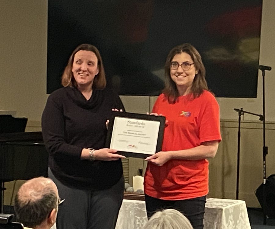 Francene receiving the certificate from MD Nonprofits.